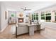 Inviting living room with a fireplace and comfortable seating area. Neutral decor and large windows offer views and natural light at 154 Colonial Trail Ct, Pittsboro, NC 27312