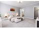Serene main bedroom with soft carpet, complemented by contemporary furnishings and neutral tones at 154 Colonial Trail Ct, Pittsboro, NC 27312