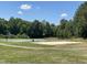 Community recreational area with a sand volleyball court and basketball court at 154 Colonial Trail Ct, Pittsboro, NC 27312