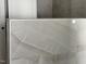 Close-up of a bathroom shower with elegant marble tile at 8305 Society Pl, Raleigh, NC 27615