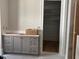 Bathroom featuring a gray vanity with a white countertop and hardware at 8305 Society Pl, Raleigh, NC 27615