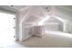 Upstairs unfinished bonus room, ready for customization with hardwood floors and access to other rooms at 8305 Society Pl, Raleigh, NC 27615
