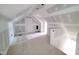 Upstairs unfinished bonus room showcasing a dormer window, closet and plenty of flexible space at 8305 Society Pl, Raleigh, NC 27615