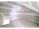 Bright unfinished attic bonus room, ready for customization with hardwood floors and dormer windows at 8305 Society Pl, Raleigh, NC 27615