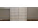 Large closet featuring light gray wooden shelves and drawers at 8305 Society Pl, Raleigh, NC 27615