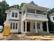An in-progress exterior elevation of a home featuring a double porch with columns and detailed trim at 8305 Society Pl, Raleigh, NC 27615