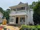 Elegant home featuring a double porch with classic columns, awaiting its final touches during construction at 8305 Society Pl, Raleigh, NC 27615