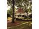 Community gazebo with red roof, white trim, green landscaping and a view of the neighborhood at 8305 Society Pl, Raleigh, NC 27615