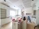 Spacious kitchen featuring white cabinetry, a central island, and hardwood flooring at 8305 Society Pl, Raleigh, NC 27615