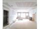 Unfinished living room with ample light from large windows at 8305 Society Pl, Raleigh, NC 27615