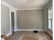 A spacious living room features fresh paint, elegant trim, and abundant natural light at 8305 Society Pl, Raleigh, NC 27615