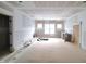 Unfinished living room with large windows and natural light at 8305 Society Pl, Raleigh, NC 27615