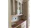 An in-progress pantry area features white cabinets, gold hardware, and white countertops at 8305 Society Pl, Raleigh, NC 27615