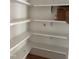 Walk-in pantry features new white shelving, ready for use at 8305 Society Pl, Raleigh, NC 27615