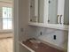 Pantry featuring white cabinetry with copper hardware and a countertop at 8305 Society Pl, Raleigh, NC 27615