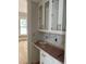 An in-progress pantry area features white cabinets, gold hardware, and white countertops at 8305 Society Pl, Raleigh, NC 27615