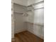 A bright, walk-in closet with custom shelving, providing ample storage space at 8305 Society Pl, Raleigh, NC 27615