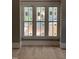 Three large windows brighten up the room and illuminate the new hardwood floors at 8305 Society Pl, Raleigh, NC 27615