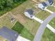 An aerial view showing a home with an expansive yard and an outbuilding in a well-maintained community at 176 Van Winkle St, Lillington, NC 27546