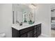 Bright bathroom featuring dual sink vanity, stylish fixtures, and decorative elements at 176 Van Winkle St, Lillington, NC 27546