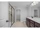 Bathroom with double vanity, walk-in shower, and large closet at 176 Van Winkle St, Lillington, NC 27546