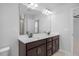 Double vanity bathroom with large mirror and tile flooring at 176 Van Winkle St, Lillington, NC 27546