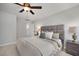 Serene bedroom featuring soft lighting, neutral tones, and a padded headboard at 176 Van Winkle St, Lillington, NC 27546