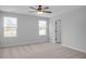 Spacious bedroom with ceiling fan, neutral walls, and carpet flooring at 176 Van Winkle St, Lillington, NC 27546