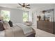 Calm bedroom with plush bedding, natural light, and a dresser with decor at 176 Van Winkle St, Lillington, NC 27546