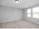 Bright bedroom with neutral walls and carpet flooring at 176 Van Winkle St, Lillington, NC 27546