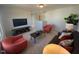 Cozy bonus room with seating area and TV at 176 Van Winkle St, Lillington, NC 27546