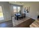 Dining room with hardwood floors and access to a deck at 176 Van Winkle St, Lillington, NC 27546