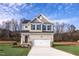 Two-story house with gray siding, white trim, and a two-car garage at 176 Van Winkle St, Lillington, NC 27546