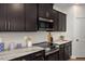 Close up of the kitchen, with stainless steel appliances and tile backsplash at 176 Van Winkle St, Lillington, NC 27546