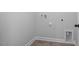 Convenient laundry room with tile flooring and space for washer/dryer at 176 Van Winkle St, Lillington, NC 27546