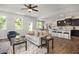 Cozy living room flowing into the dining and kitchen areas, perfect for entertaining at 176 Van Winkle St, Lillington, NC 27546