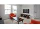 Bright living room with neutral walls, large windows, and modern furniture at 176 Van Winkle St, Lillington, NC 27546