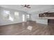 Open living space featuring hardwood floors and an island kitchen at 176 Van Winkle St, Lillington, NC 27546