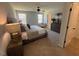 Bright main bedroom with plush carpet, ceiling fan and ensuite bathroom at 176 Van Winkle St, Lillington, NC 27546
