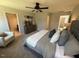 Main bedroom with king-size bed, plush carpet, and sitting area at 176 Van Winkle St, Lillington, NC 27546