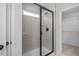Walk-in shower with tiled walls and glass enclosure at 176 Van Winkle St, Lillington, NC 27546
