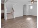 Modern staircase with carpeted steps and hardwood floors at 176 Van Winkle St, Lillington, NC 27546