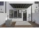 A private back patio features an exterior door, air conditioning unit, and concrete base perfect for relaxation at 4015 Elk Creek Ln, Raleigh, NC 27612