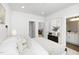 Bright bedroom with contemporary decor, featuring a comfortable bed and easy access to the walk-in closet and en-suite bathroom at 4015 Elk Creek Ln, Raleigh, NC 27612