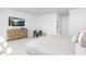 Bright bedroom featuring plush bedding, stylish decor, and modern entertainment at 4015 Elk Creek Ln, Raleigh, NC 27612