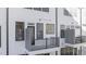 Townhome exterior with private balconies and modern design elements, providing a stylish and inviting living space at 4015 Elk Creek Ln, Raleigh, NC 27612