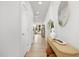 Bright hallway featuring modern decor, wood flooring, and ample natural light at 4015 Elk Creek Ln, Raleigh, NC 27612