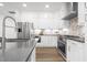 Modern kitchen featuring stainless steel appliances, ample cabinetry, and sleek countertops at 4015 Elk Creek Ln, Raleigh, NC 27612