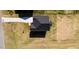 Aerial view of a home's roof, driveway, and surrounding expansive lawn at 592 Barbour Farm Ln, Four Oaks, NC 27524