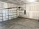 Spacious two-car garage interior, freshly painted with a concrete floor and an automatic door opener at 592 Barbour Farm Ln, Four Oaks, NC 27524